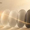 Photochromic optical lenses demonstrating light-adaptive technology and protection in warm cream-toned design.
