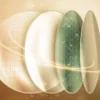 Premium layered optical lens design with advanced coating and warm cream lighting.