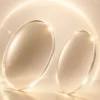 Comparison of polycarbonate and high index optical lenses with premium cream lighting and modern design.