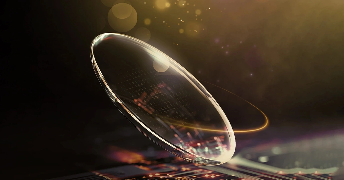 Glowing premium optical lens with warm golden halo light and reflective surface.